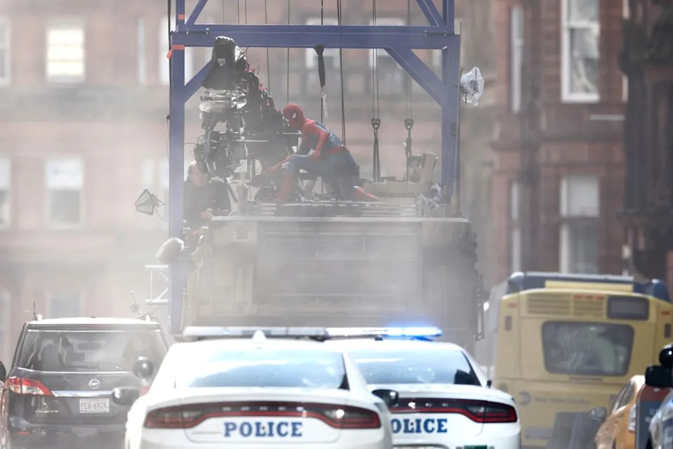NYPD vehicles storm the scene while Holland’s Spider-Man attempts to stop the destruction. DMC / SplashNews.com