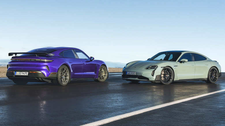 A pair of 2024 Porsche Taycan Turbo GTs, with and without Weissach Pack, parked nose to nose