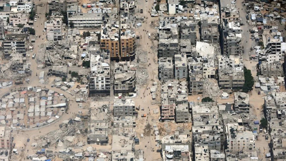 A view from the air as Jordanian air force personnel perform an air drop of aid and humanitarian supplies in Gaza on Wednesday. - Salah Malkawi/Getty Images