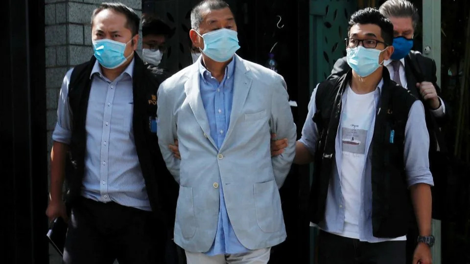 Media mogul Jimmy Lai Chee-ying, founder of Apple Daily (C) is detained by the national security unit in Hong Kong, China August 10, 2020. - Tyrone Siu/Reuters
