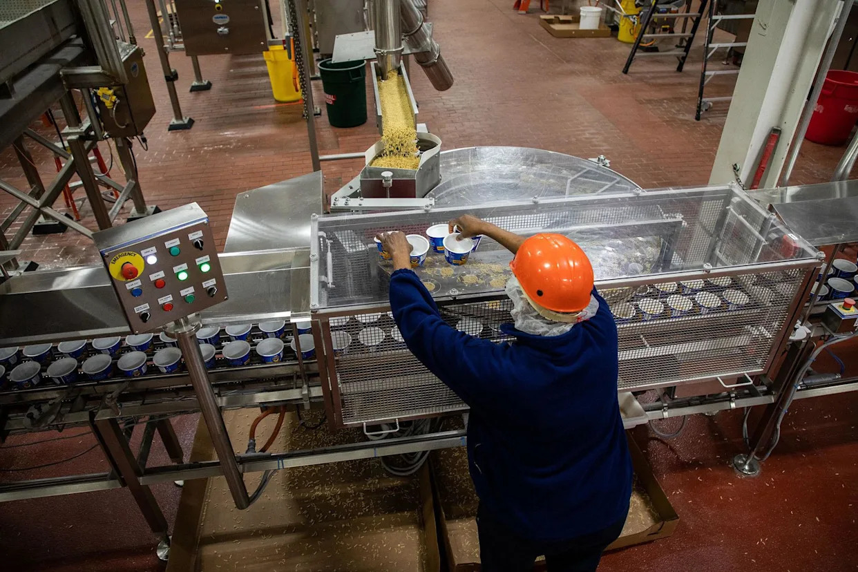 <span>A production line at a Kraft Heinz plant in Champaign, Illinois in March 2020. In another factory in Holland, Michigan, workers are being asked to work overtime.</span><span>Photograph: Chicago Tribune/TNS/Getty Images</span>