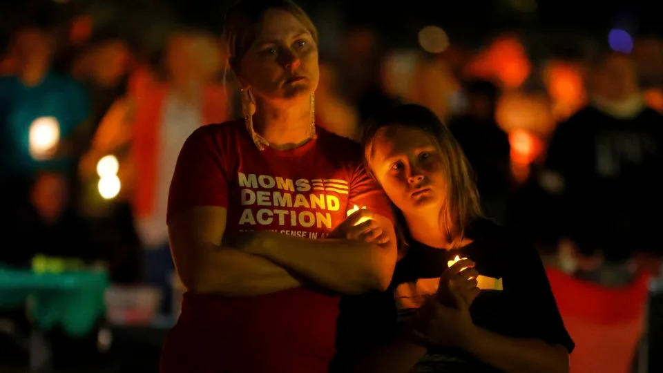 People gather at a vigil at Lynnhurst Park after a shooting at the Annunciation Catholic School Wednesday, in Minneapolis. - Bruce Kluckhohn/AP