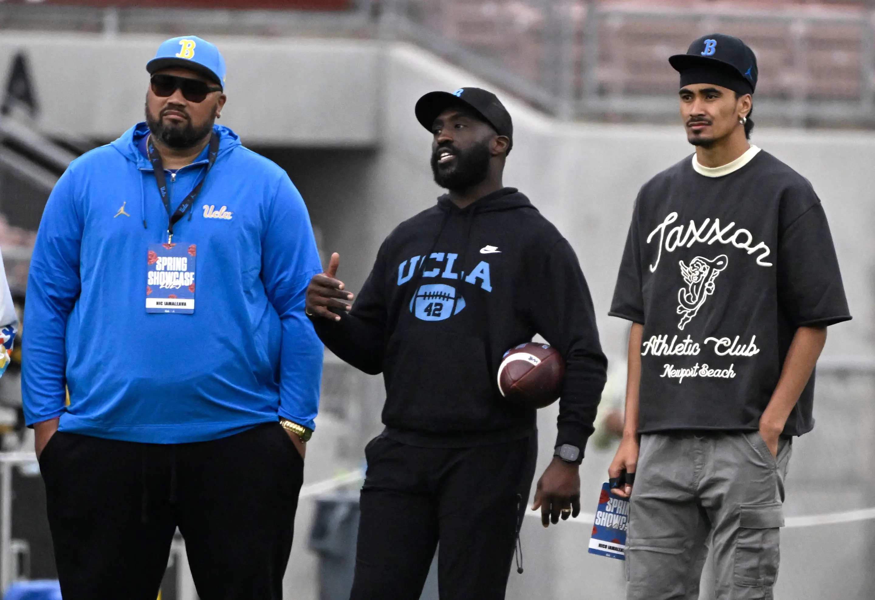 Pasadena, CA - May 03: Quarterback Nico Iamaleava, right, of the UCLA Bruins with head coach DeShaun Foster of the UCLA Bruins and Nic Iamaleava, left, during the UCLA football spring practice at the Rose Bowl in Pasadena on Saturday, May 3, 2025.(Photo by Keith Birmingham/MediaNews Group/Pasadena Star-News via Getty Images)
