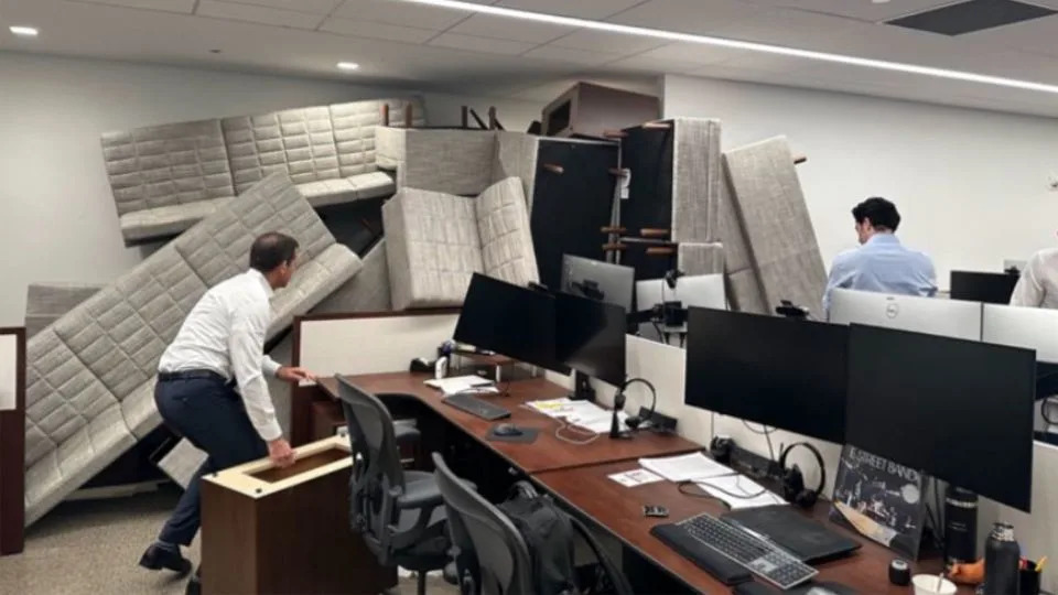 Photos posted to X show how employees pushed furniture up against their office entryway to create a barricade during the shooting. - Obtained by CNN