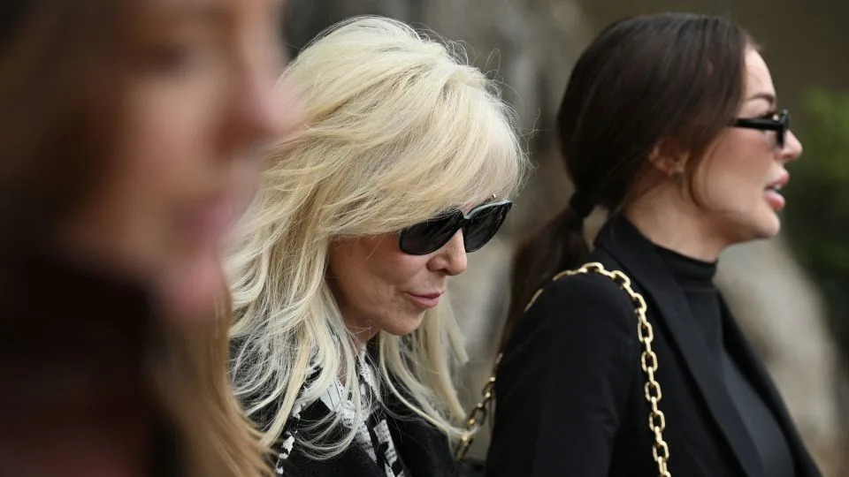 Erik Menendez's wife, Tammi Menendez, center, leaves the Van Nuys West Courthouse after a status hearing on the murder conviction of Lyle and Erik Menendez on November 25, 2024. - Robyn Beck/AFP/Getty Images