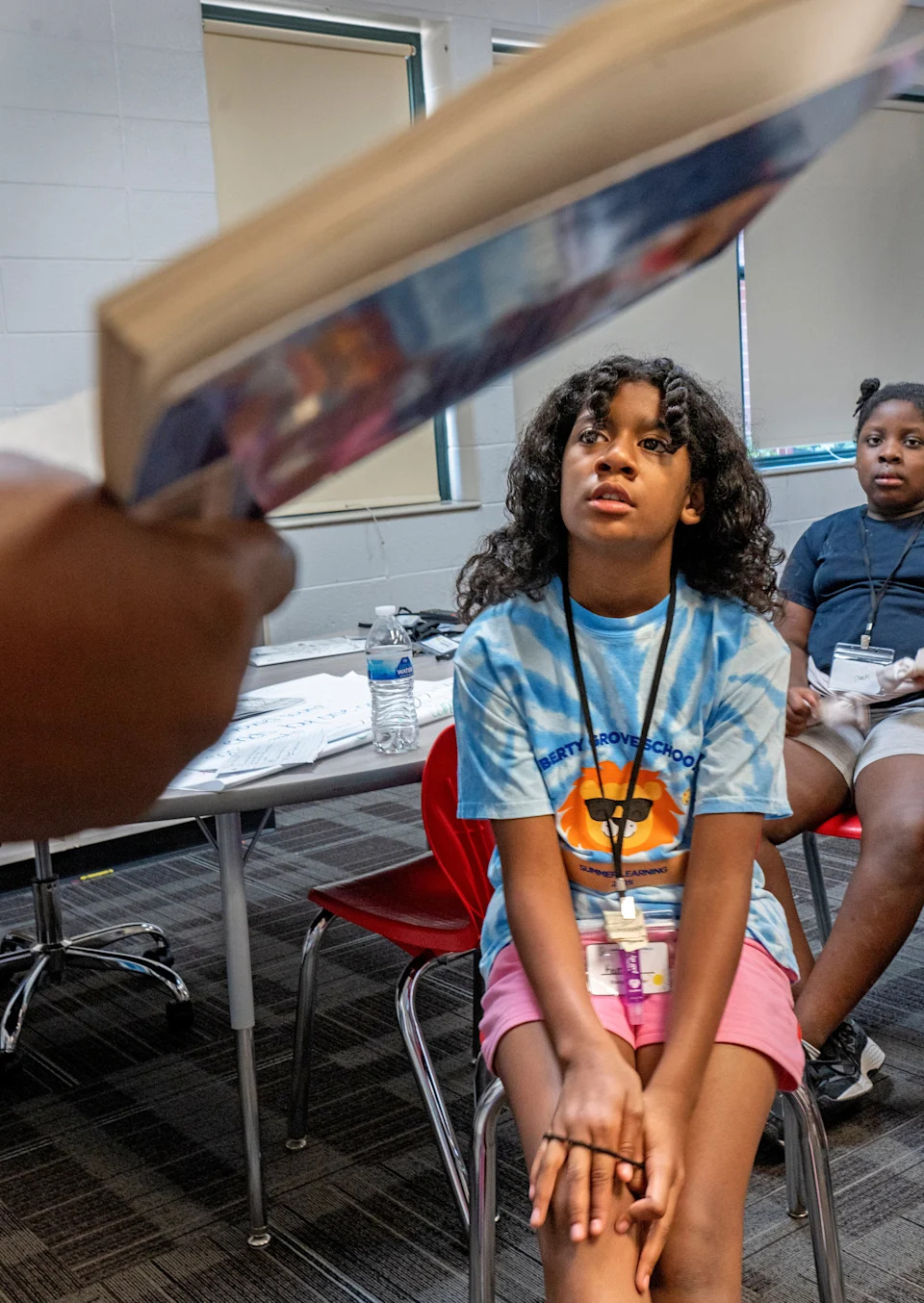 Rising third grader, Kamari, listens as her teacher reads to the class rising third grade during the summer learning session Wednesday, June 25, 2025 in the Liberty Grove Schools at Elder W. Diggs School 42. Indy Summer Learning Labs are designed to help young students with literacy and other subjects. The new third-grade hold-back law is now in effect for third graders who don’t pass IREAD this year.