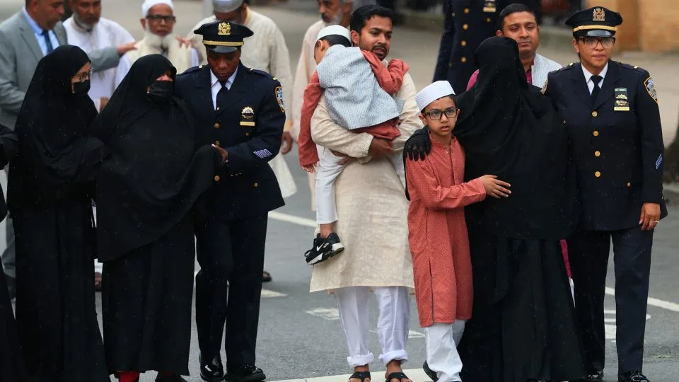 Islam's family members walked behind his casket. Mayor Eric Adams called on New Yorkers to "stand in unison with this family and this city as we heal together." - Michael M. Santiago/Getty Images