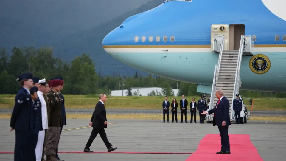 President Donald Trump greets Russian President Vladimir Putin as he arrives at Joint Base Elmendorf-Richardson on Friday in Anchorage, Alaska. - Andrew Harnik/Getty Images