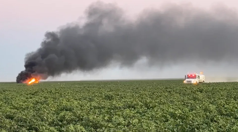 Plumes of black smoke were seen blowing across a field at around 6:40 p.m. Wednesday, after Fresno County officials said they received a report of a military jet “engulfed in flames” (Fresno County Sheriff's Office)