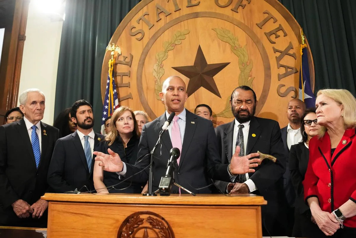 U.S. House Minority Leader Hakeem Jeffries gives his support to Texas Democrats fighting a Republican redistricting effort on July 31, 2025. Standing behind Jeffries, left to right, are Rep. Lloyd Doggett of Austin, U.S. Rep. Greg Casar of Austin, Rep. Lizzie Fletcher of Houston, Rep. Al Green of Houston and Rep. Sylvia Garcia of Houston. <cite>Credit: Bob Daemmrich for The Texas Tribune</cite>