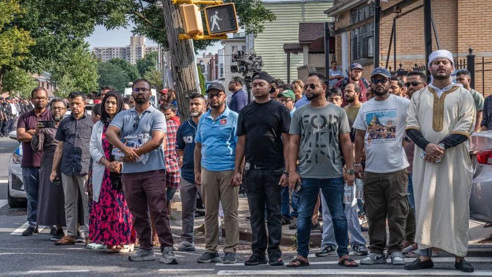 Community members lined the streets outside the Parkchester Jame Masjid Mosque in the Bronx to honor slain Officer Didarul Islam. - Timothy Fadek for CNN