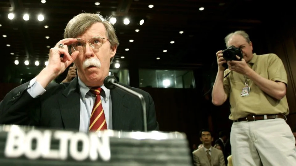 John Bolton adjusts his glasses as he prepares to speak at a Senate Foreign Relations Committee hearing on his nomination for US Ambassador to the UN, on April 11, 2005. - Jason Reed/Reuters/File