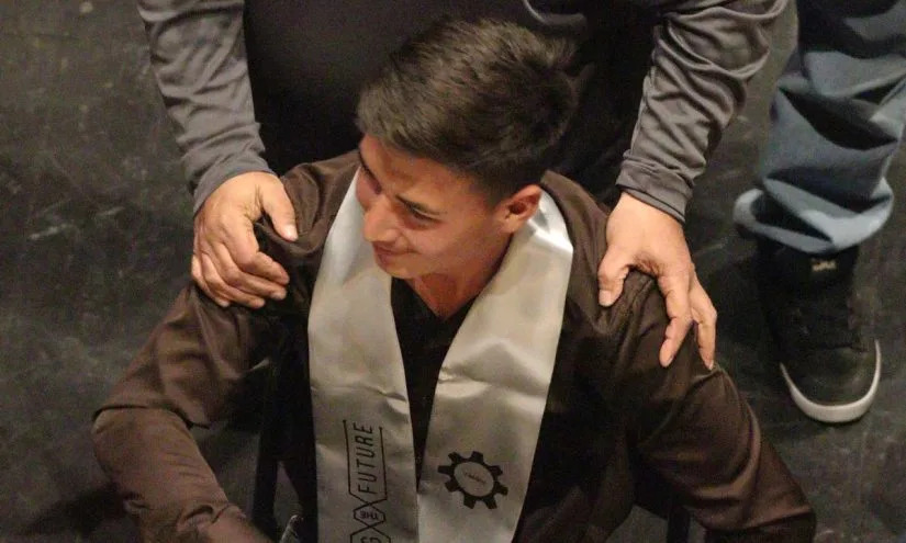 Valley High School senior Dominic Duran, wearing a graduation stole signifying his mastery of welding. As a sophomore, he was going to drop out of school, until Shawn Coffey persuaded him to stay. (Albuquerque Public Schools)
