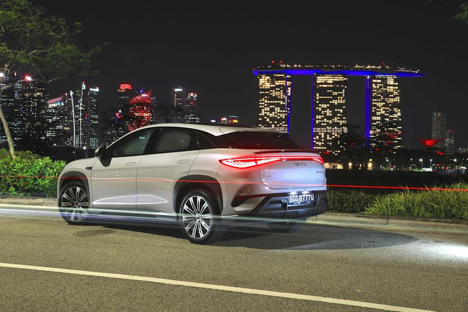 BYD Sealion 7 driving with Marina Bay Sands in Singapore in the background.