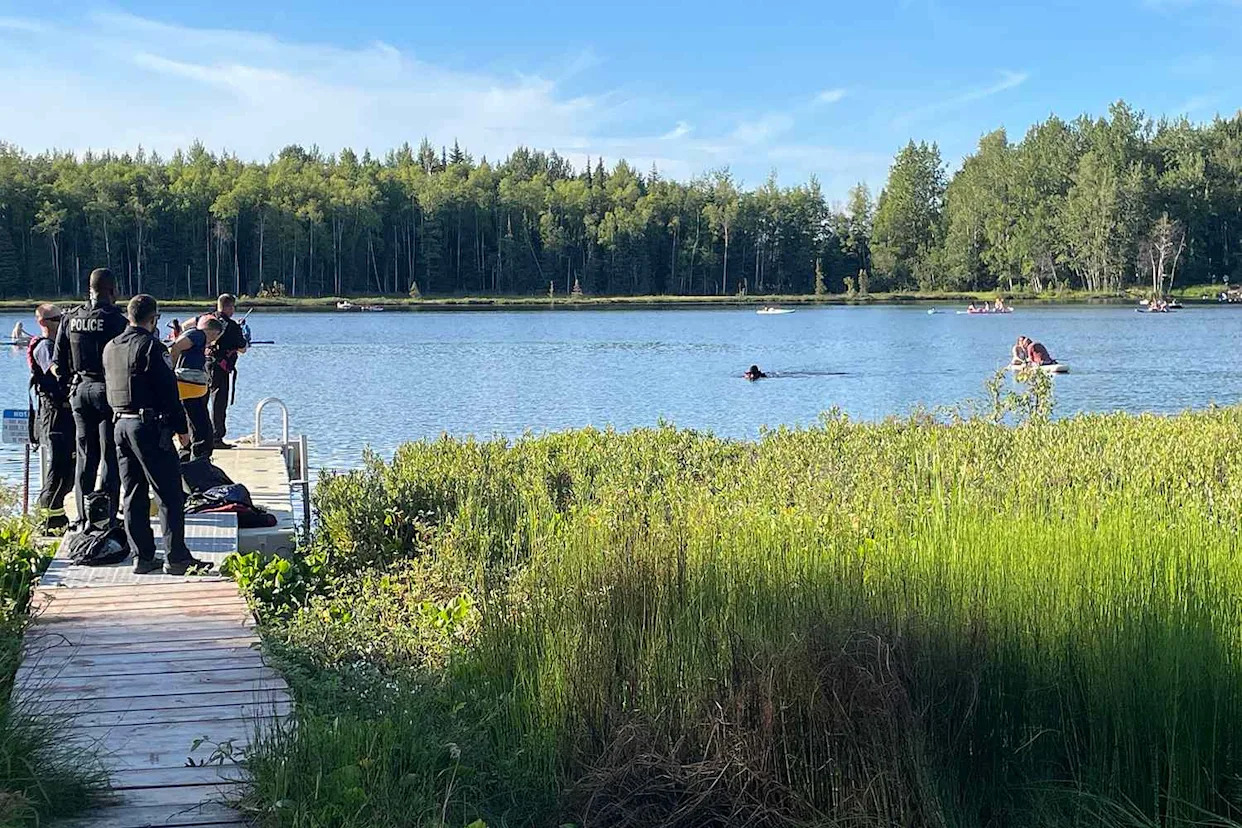 The Anchorage Fire Department/Facebook Crews search for a missing paddle boarder in a lake in Anchorage