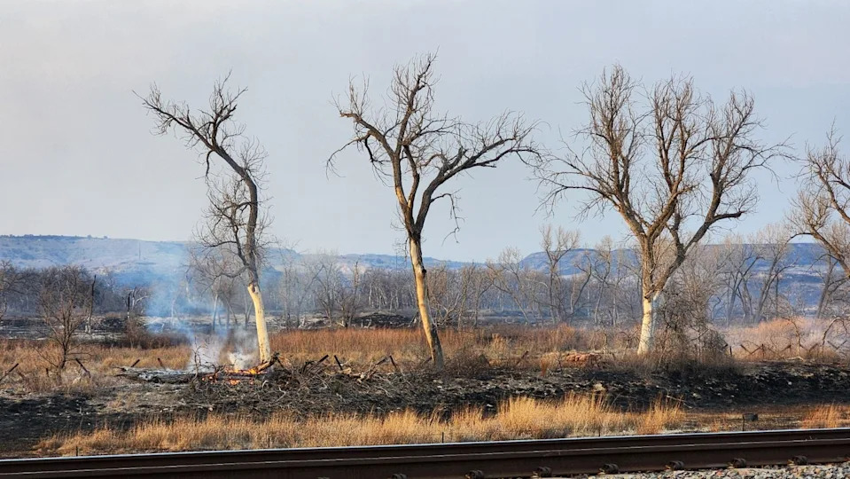 In this February 2024 file photo, terrain continues to smolder in the outlying boundaries of the Smokehouse Creek Fire, near Miami, Texas, as it had spread to an estimated 850,000 acres and 3% contained.