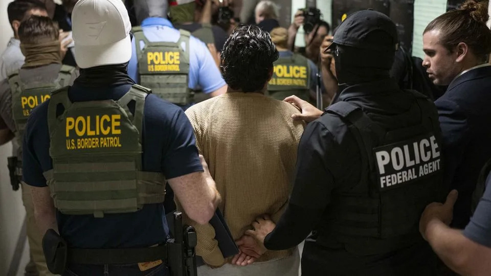 Federal agents detain a person after attending a court hearing at immigration court at the Jacob K. Javitz Federal Building on July 1 in New York City, New York. - Mostafa Bassim/Anadolu/Getty Images
