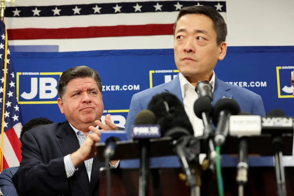 Texas State Rep. Gene Wu holds a press conference in Carol Stream, Illinois, on Sunday August 3 2025 after fleeing a Republican gerrymandering push as Illinois Governor JB Pritzker looks on (Reuters)