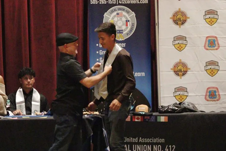 Welding teacher Shawn Coffey and graduate Dominic Duran. (Albuquerque Public Schools)