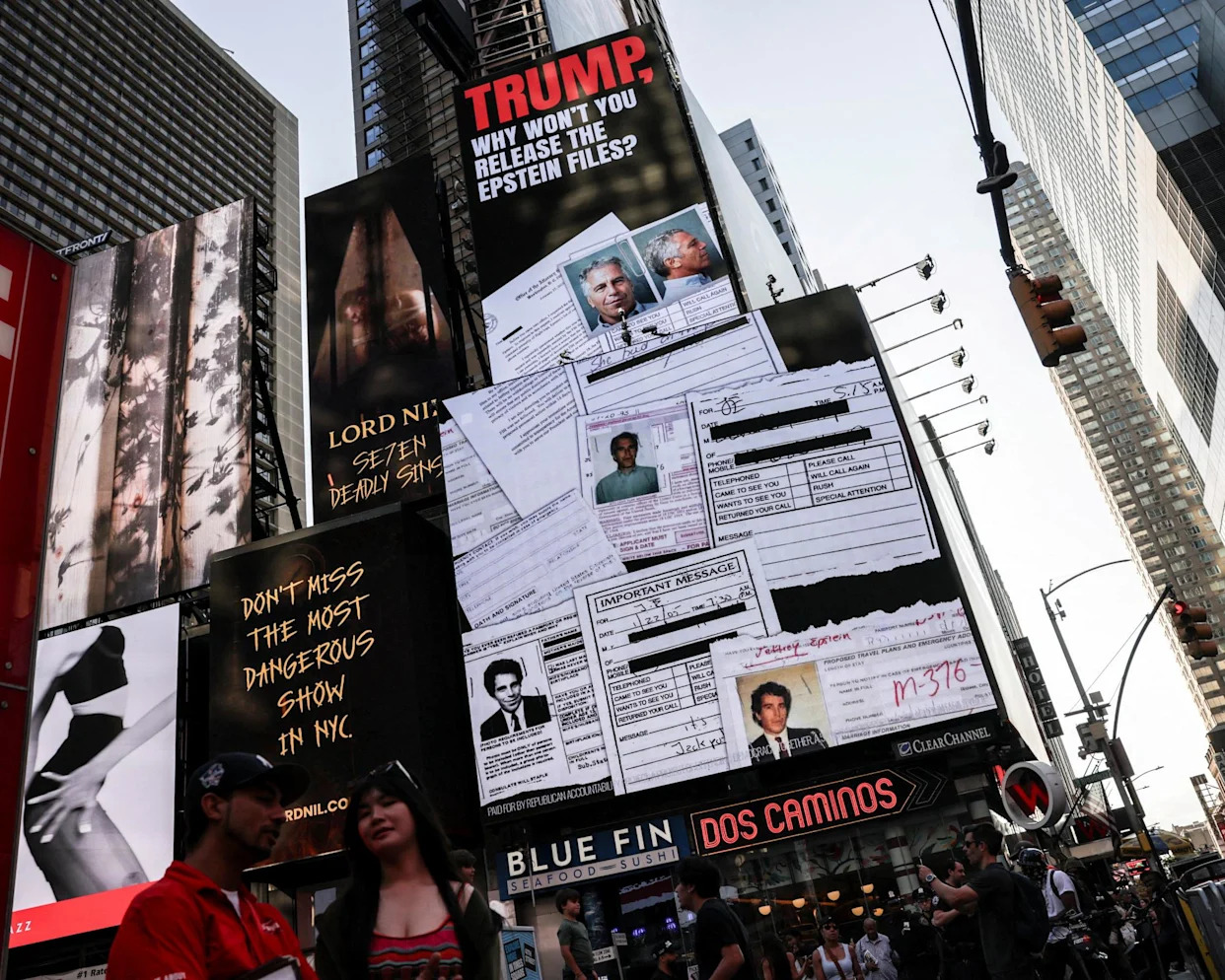 <span>A screen about the Jeffrey Epstein files is displayed at Times Square in New York City, 23 July.</span><span>Photograph: Jeenah Moon/Reuters</span>