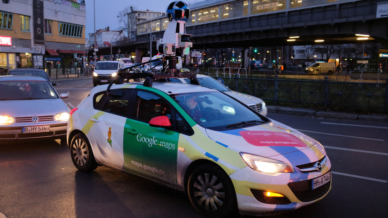 A Google Maps Street View car with an omnidirectional camera mounted on its roof drives through the Kottbuser Tur intersection in Kreuzberg district on November 29, 2017 in Berlin, Germany. Google Maps is popular in Germany though its Street View function, which allows a user to take a virtual journey through photographed streets, has come under fire by privacy protection activists.