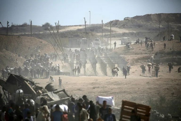 The UN human rights office and Human Rights Watch say Palestinians seeking food from US-backed Gaza Humanitarian Foundation (GHF) group have come under fire and been killed in their hundreds. Israel says its troops do not target civilians (Eyad BABA)