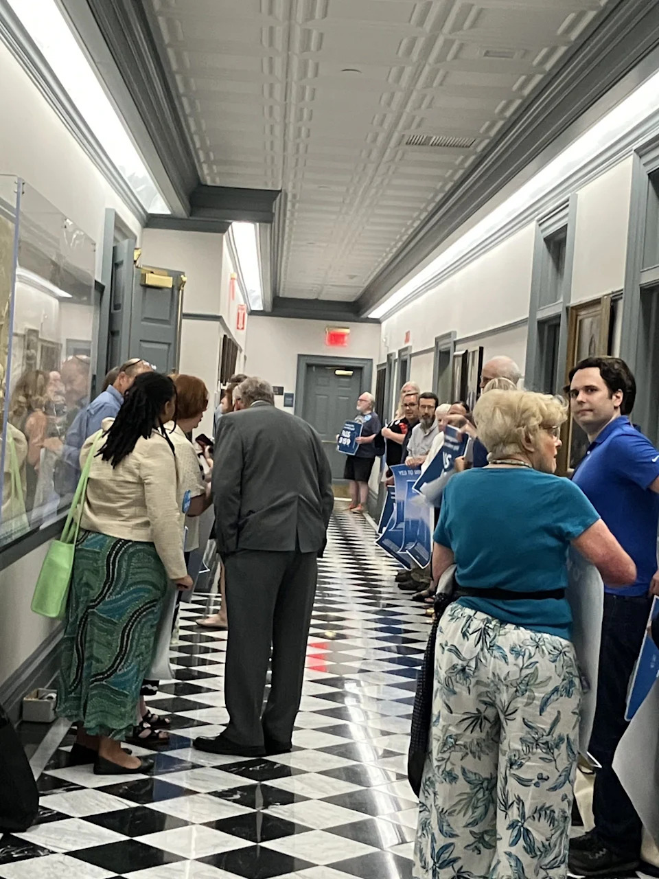 A group of some two dozen protesters from the Sierra Club lined the halls in Legislative Hall Monday, June 30, 2025, pushing lawmakers to pass a controversial bill that would overrule Sussex County’s denial of permits for a substation enabling an offshore wind farm.