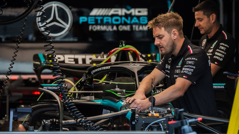 Formula 1 Mercedes AMG Petronas mechanic working on F1 car