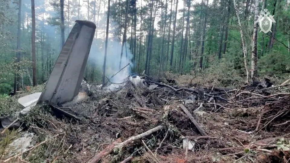 A view shows the debris of an Angara Airlines An-24 passenger aircraft at the crash site near Tynda in the Amur Region, Russia, July 24, 2025, in this still image taken from video. - Russian Investigative Committee/Handout/Reuters
