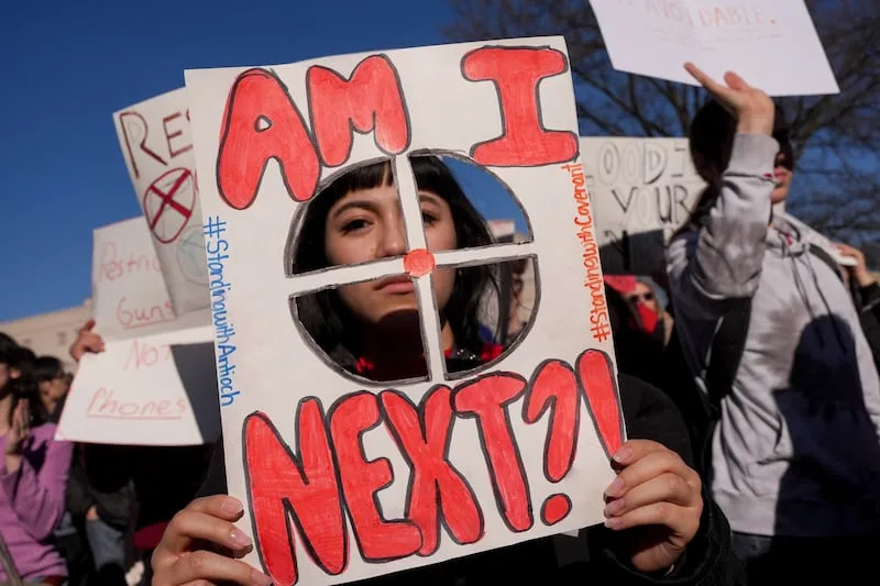 Maritza Huipe holds a sign during a rally against gun violence outside the state Capitol, Monday, Jan. 27, 2025, in Nashville, Tenn. | George Walker IV, Associated Press