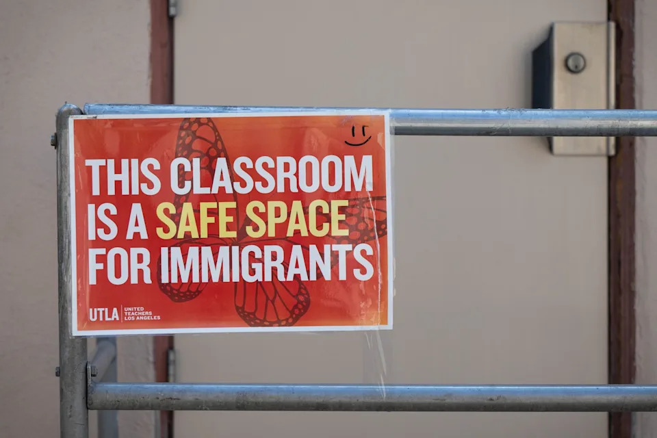 Sarah Reingewirtz/MediaNews Group/Los Angeles Daily News via Getty Images - PHOTO: A UTLA sign in support of immigrant students is seen posted on a bungalow door at Sepulveda Middle School in North Hills during the first day of school, August 14, 2025.