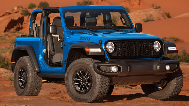 A blue 2025 Jeep Wrangler Willys two-door in the desert