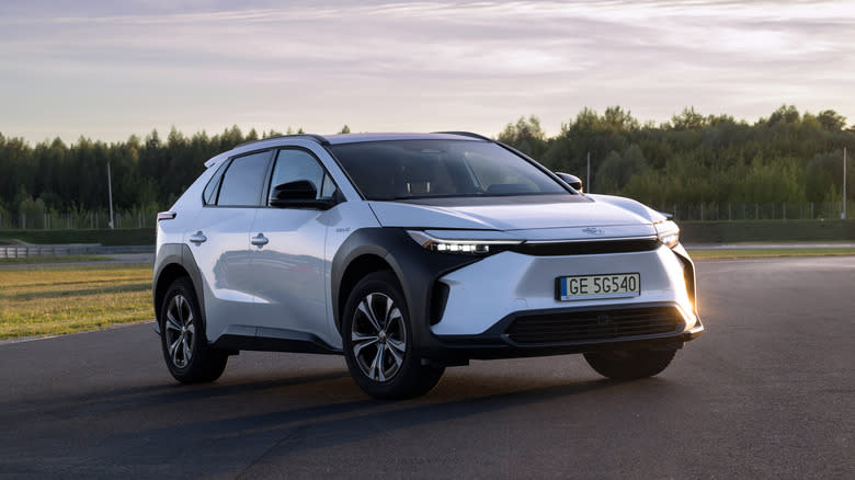 Electric SUV Toyota bZ4X on a road. This model is the first mass-produced electric vehicle from Toyota.
