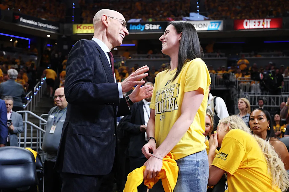 INDIANAPOLIS, INDIANA - JUNE 11: NBA Commissioner Adam Silver and Caitlin Clark of the Indiana Fever speak during Game Three of the 2025 NBA Finals between the Indiana Pacers and the Oklahoma City Thunder at Gainbridge Fieldhouse on June 11, 2025 in Indianapolis, Indiana. NOTE TO USER: User expressly acknowledges and agrees that, by downloading and or using this photograph, User is consenting to the terms and conditions of the Getty Images License Agreement. (Photo by Maddie Meyer/Getty Images)