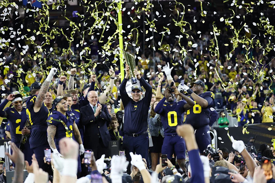 HOUSTON, TEXAS - JANUARY 8: Jim Harbaugh and The Michigan Wolverines celebrate after defeating the Washington Huskies 34-13 to win the CFP National Championship game at NRG Stadium on January 8, 2024 in Houston, Texas. (Photo by CFP/Getty Images)