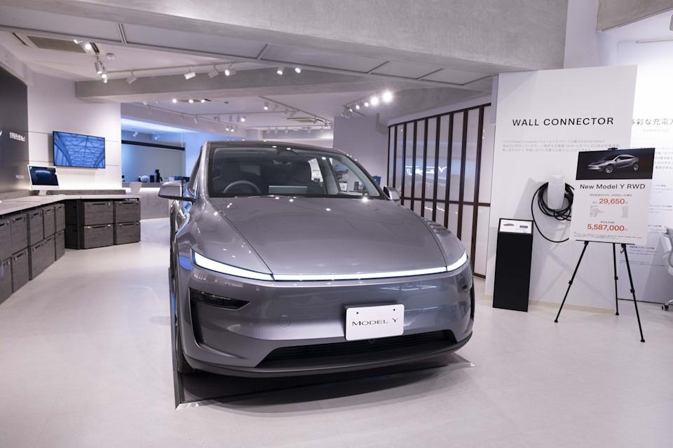 tesla model y on display inside the tesla pop up store near...