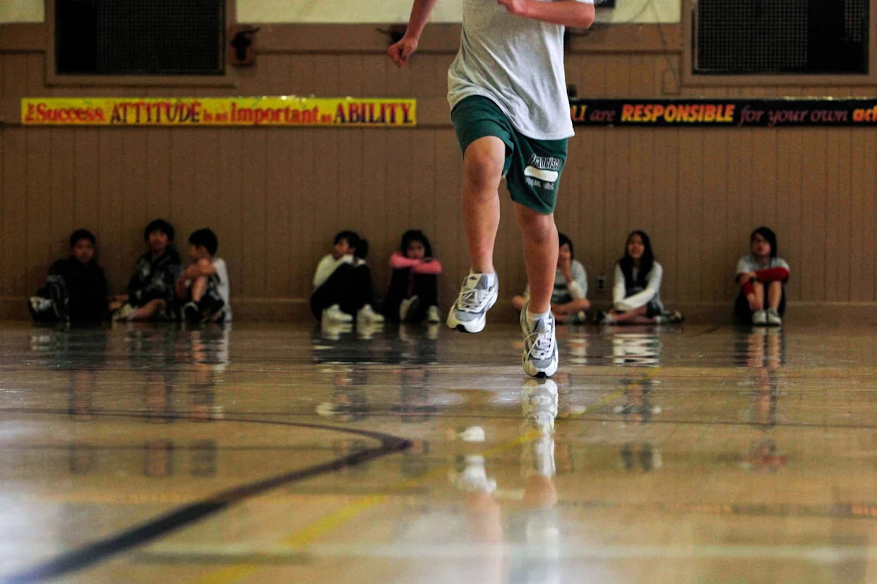 A student runs across the gym floor (Lea Suzuki / San Francisco Chronicle via Getty Images file)