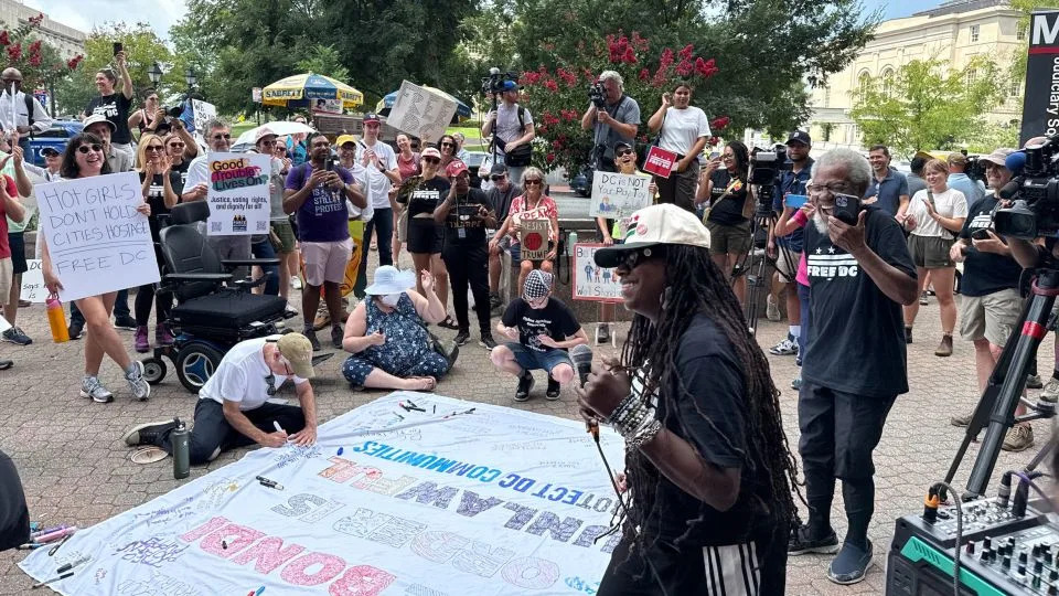 Demonstrators gather near police headquarters to protest Donald Trump’s federal takeover of Washington, DC, on Friday. - Camila DeChalus/CNN