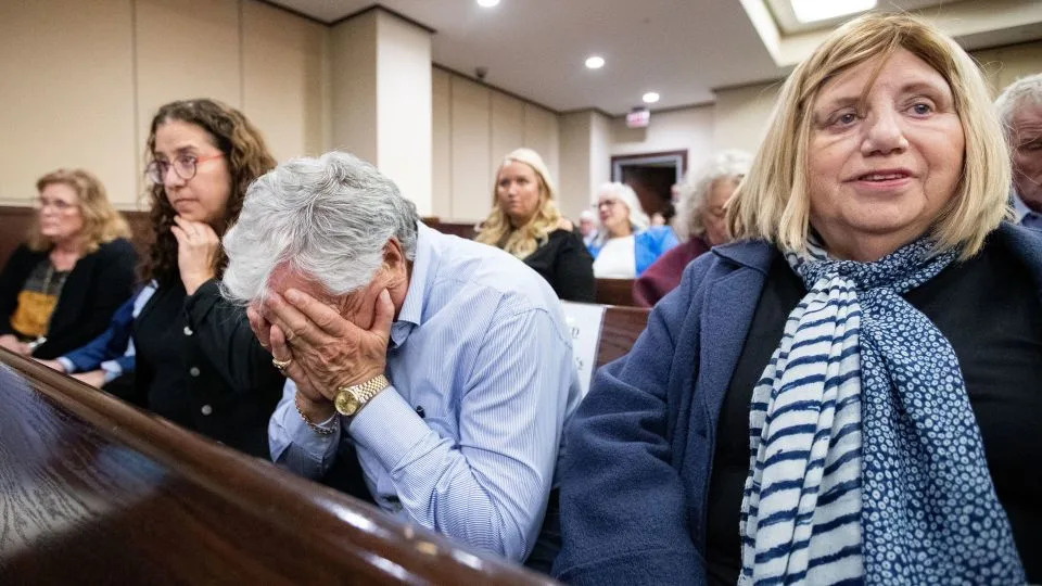 Phil Markel buries his face in his hands after hearing a jury found Charlie Adelson guilty on all three counts for the murder of his son, Dan Markel on November 6, 2023. - Alicia Devine/Tallahassee Democrat/USA Today Network/Imagn Images