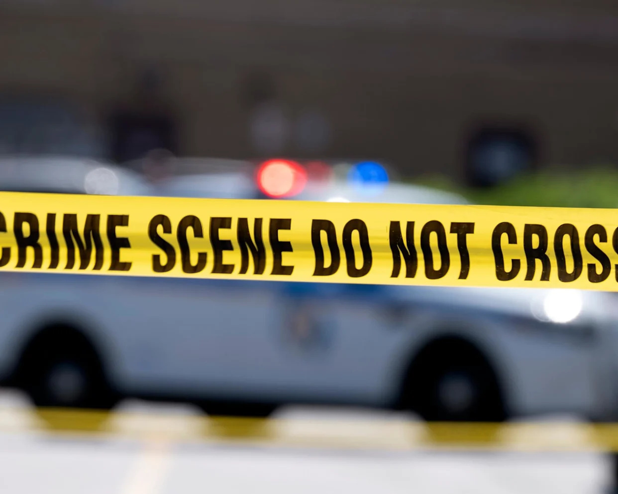 <span>Yellow crime tape.</span><span>Photograph: José Luis Magaña/AP</span>