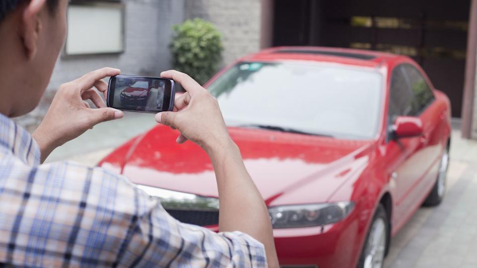 taking photo of car