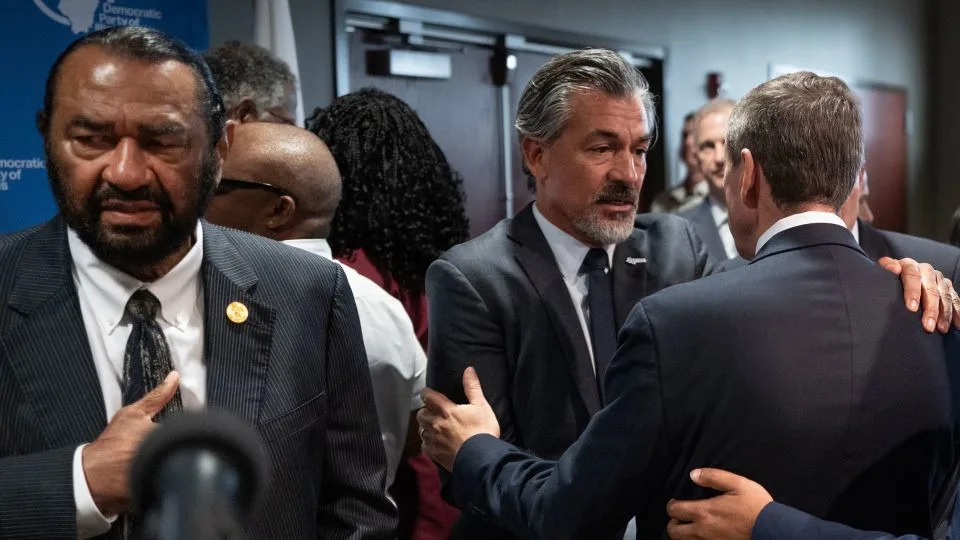 Rep. Al Green and State Rep. Ramón Romero attend a press conference of Texas House Democrats in Aurora, Illinois, on Tuesday. - Scott Olson/Getty Images