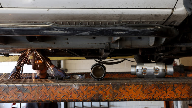 Luis Benitez welds a new catalytic converter onto a Chevrolet Silverado at Johnny Franklin's Muffler on July 11, 2022 in San Rafael, California.