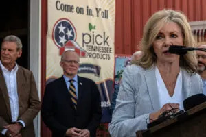 U.S. Sen. Marsha Blackburn speaks at a Future Farmers of America breakfast featuring U.S. Agriculture Secretary Brooke Rollins on Aug. 28, 2025. Standing behind Blackburn is Tennessee Gov. Bill Lee and U.S. Rep. John Rose. (John Partipilo/Tennessee Lookout)