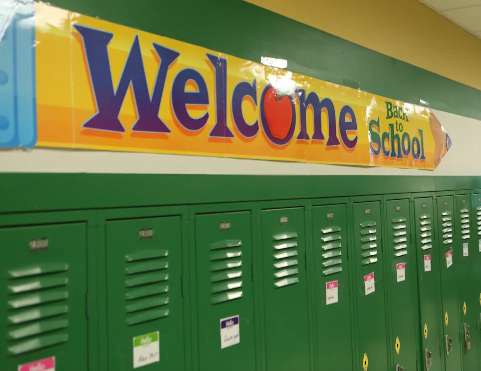A sign in one of the hallways at the Bayard School in Wilmington welcomes students back to classes.