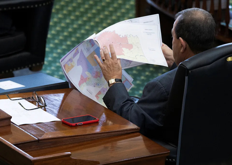 Republican State Senator Pete Flores looks over redistricting maps as the Republicans attempt to pass a bill that would redraw the state's 38 congressional districts, at the Texas State Capitol in Austin, Texas, on Aug. 22, 2025.