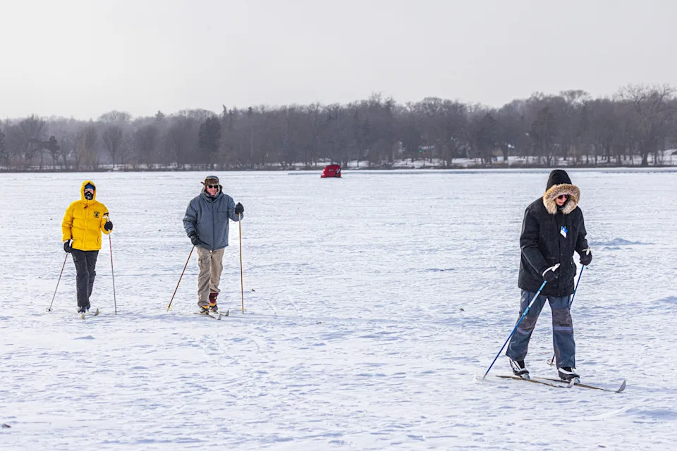 Cross-country skiers brave the frigid temperatures – 18 degrees Fahrenheit with wind chill of minus 29 degrees – at Lake Nokomis in Minneapolis, Minnesota, on January 20, 2025.
