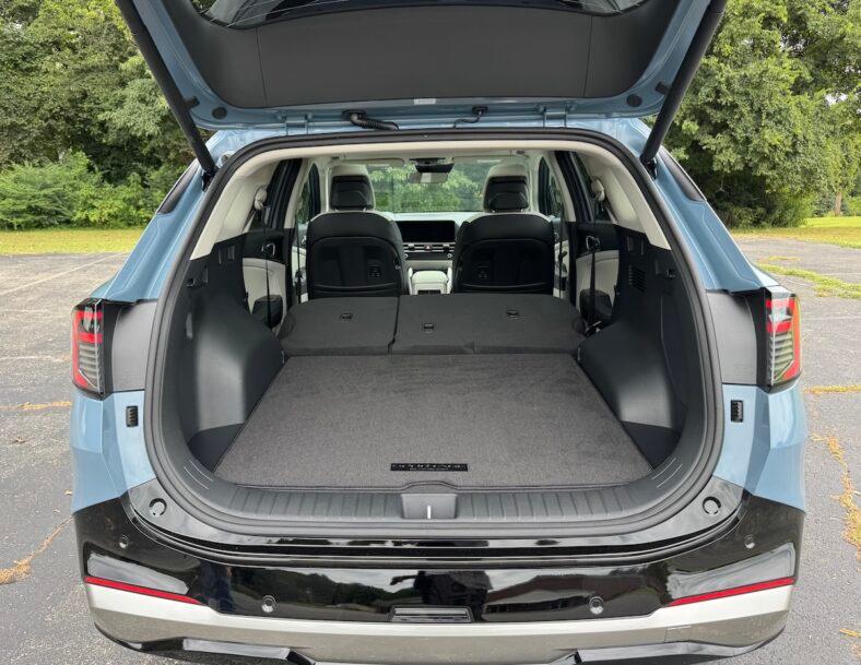 The cargo area with all the seats folded in the 2026 Kia Sportage