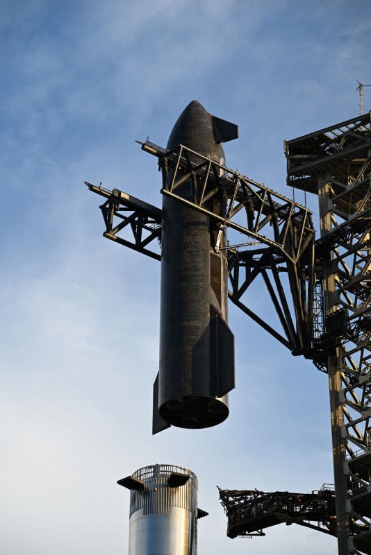 A SpaceX Starship is lifted to mate to the Super Heavy booster on Launch Complex 1. Photo by Joe Marino/UPI
