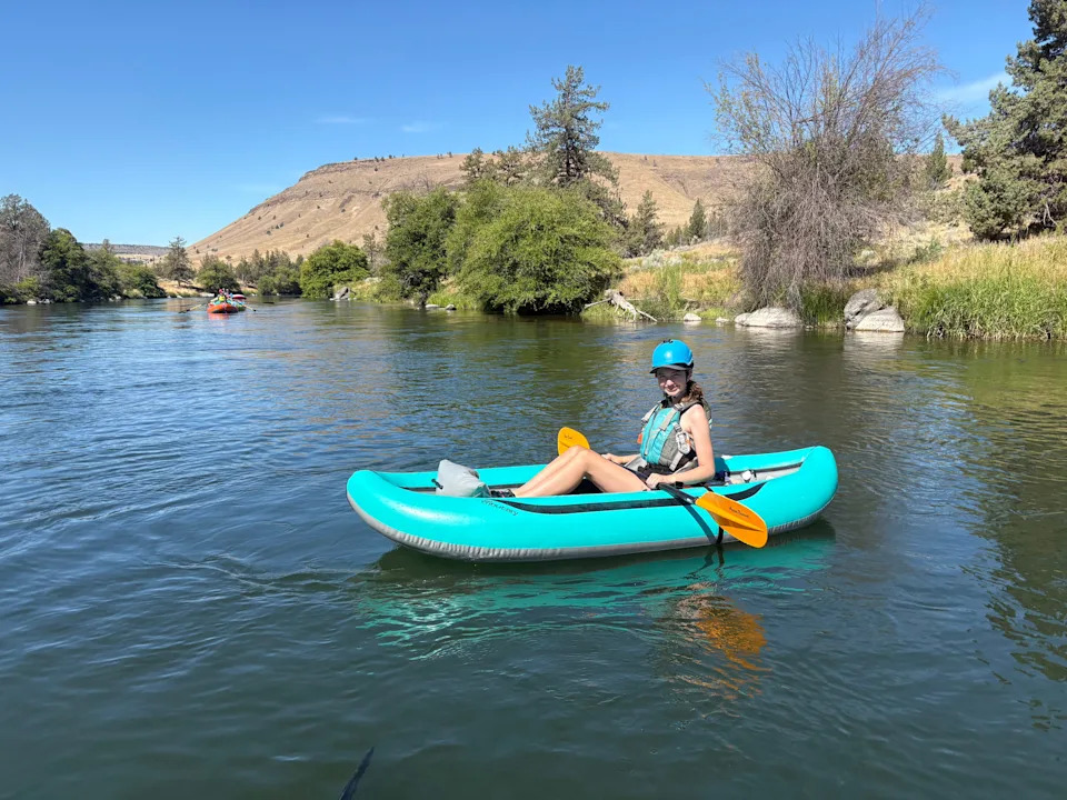 Emma Linkhart, 14, paddles an inflatable kayak on the Deschutes River. Under a new law going into place Jan. 1, 2026, she would need a Waterway Access Permit. A group called Let Us Paddle is fighting the law and looking to eliminate the entire permit system for all human-powered boats.